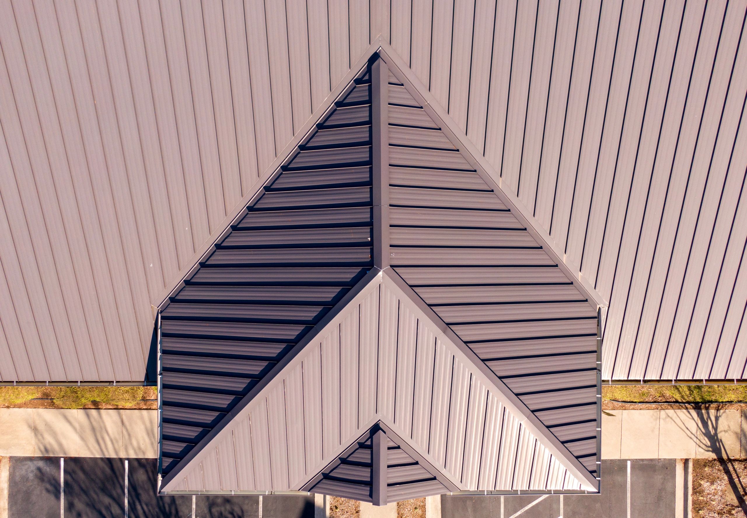 Aerial view of a standing seam metal roof on a commercial building